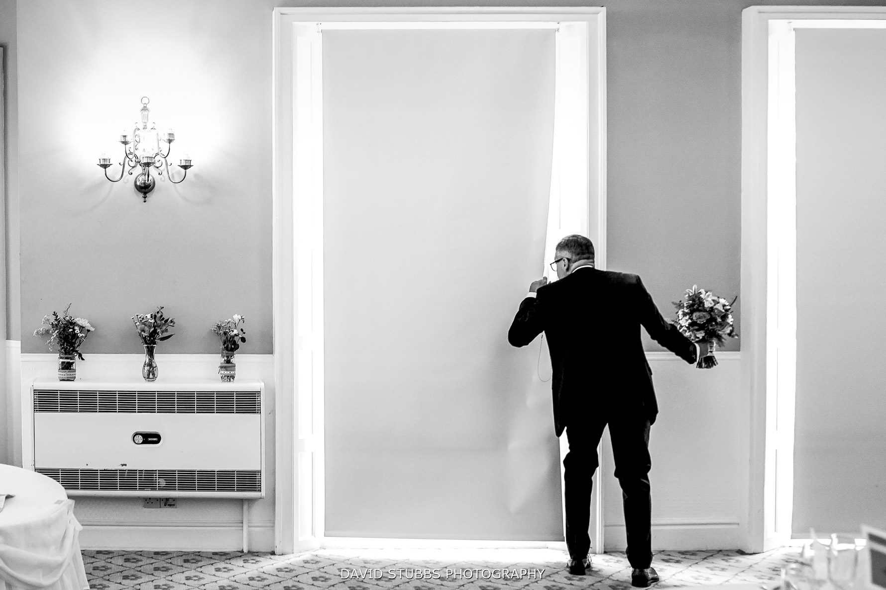 dad peeking through the curtains