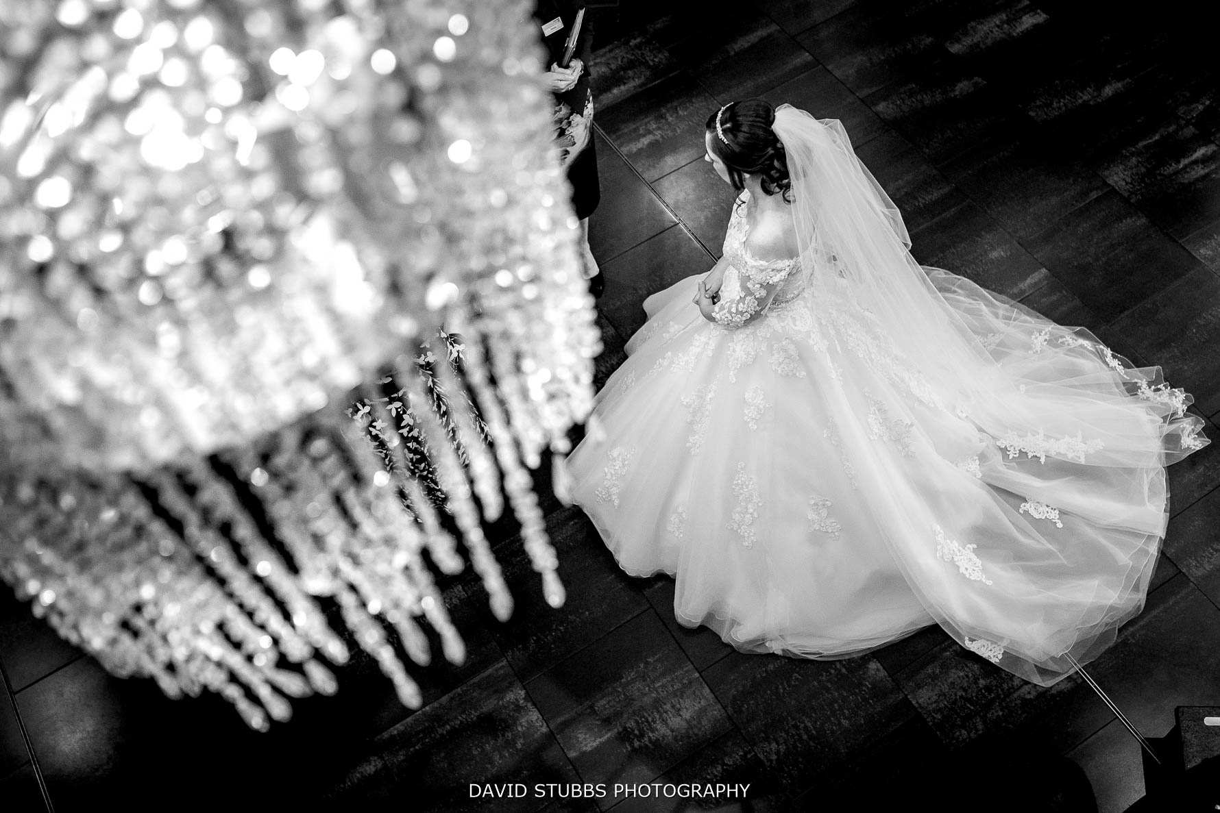 bride and wedding dress with Stanley house chandelier