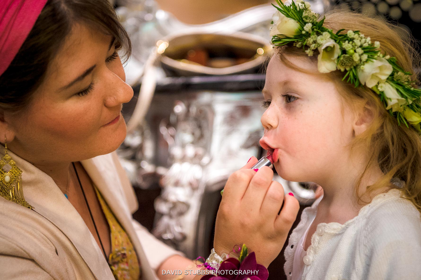 flower girl having lipstick put on