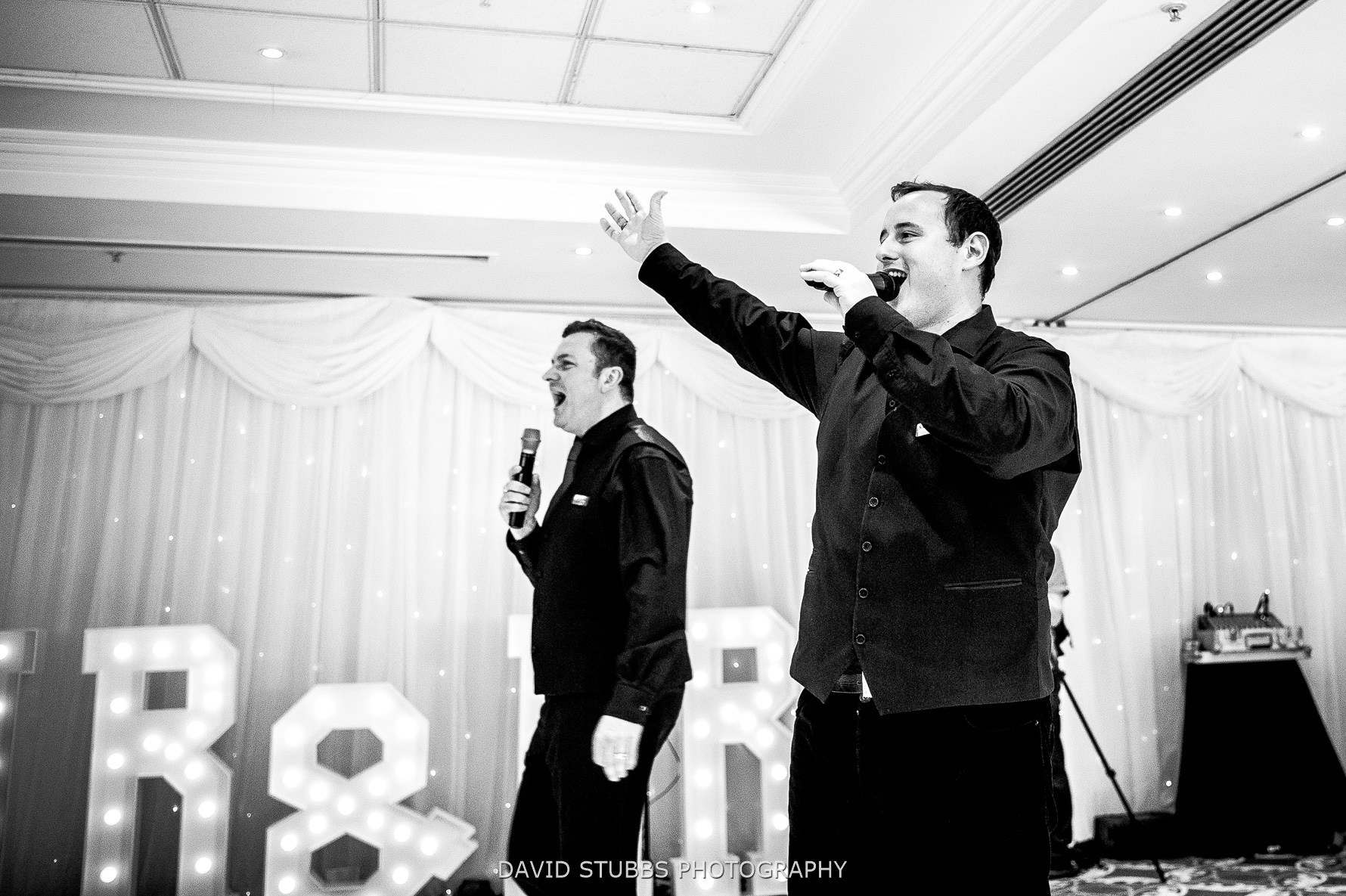 singing waiters enter hotel