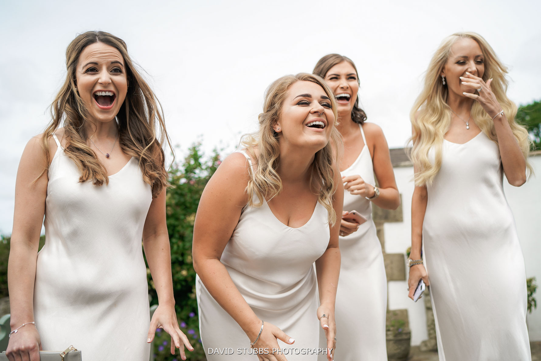 bridesmaids reaction to bride in her wedding dress