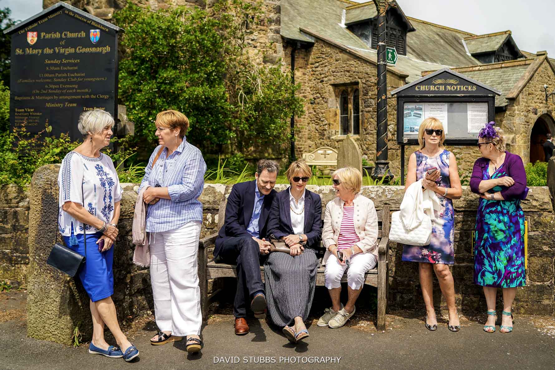 guests sitting and waiting outside the ceremony location