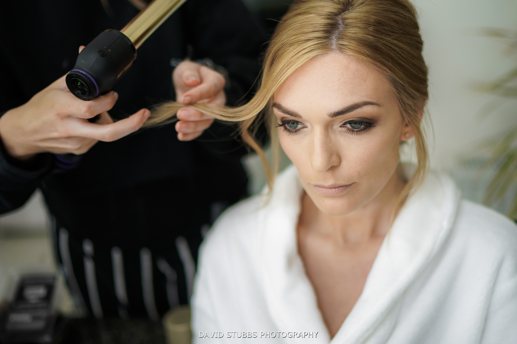 bride having hair and make up applied