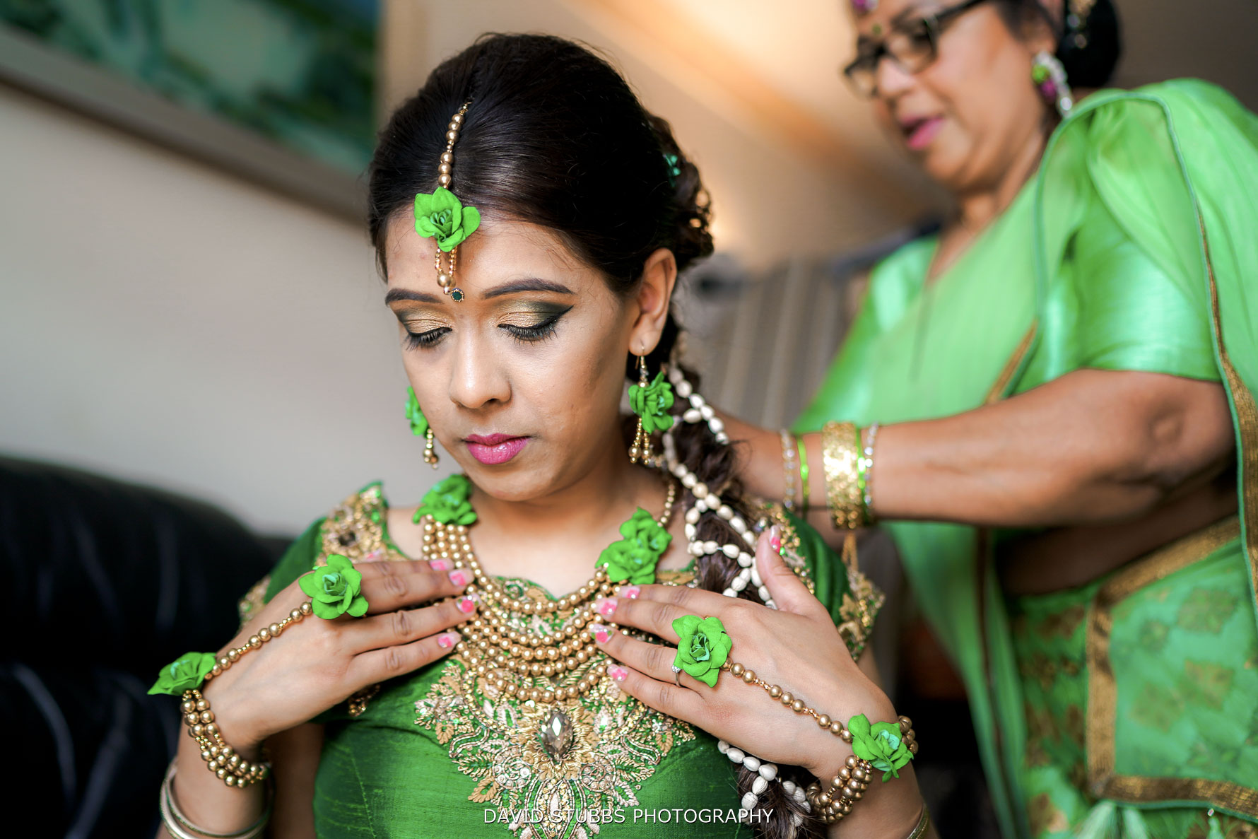 dipti having her dress put on