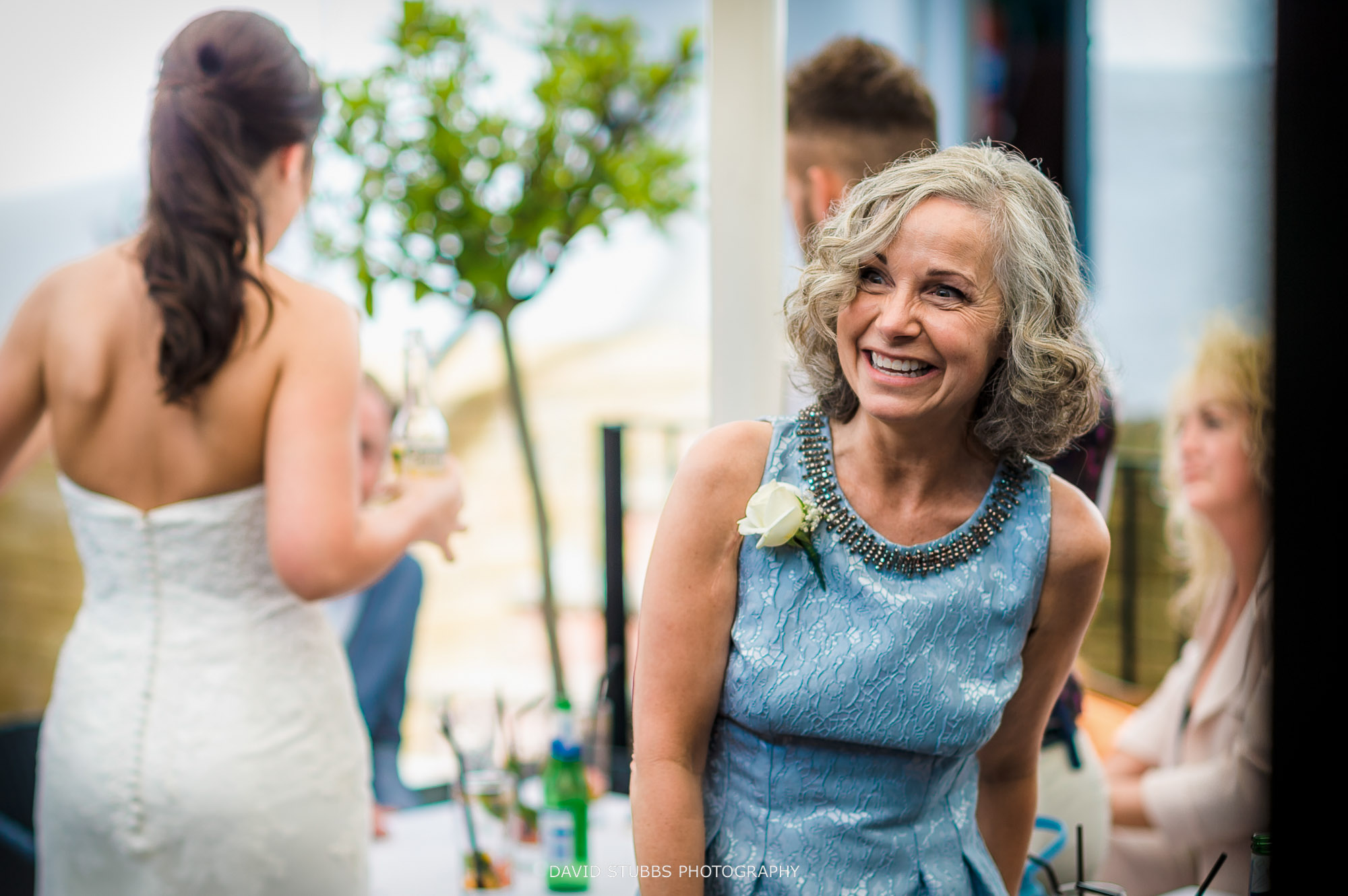 wedding guest smiling
